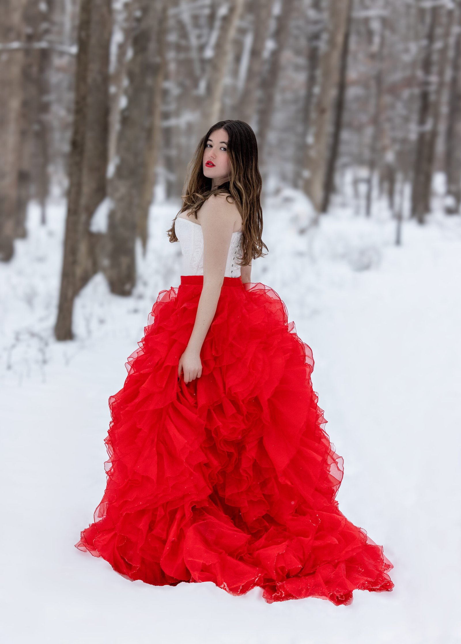 Senior Portraits in Loudoun County Leesburg Ashburn Virginia Snow picture with large red skirt and corset