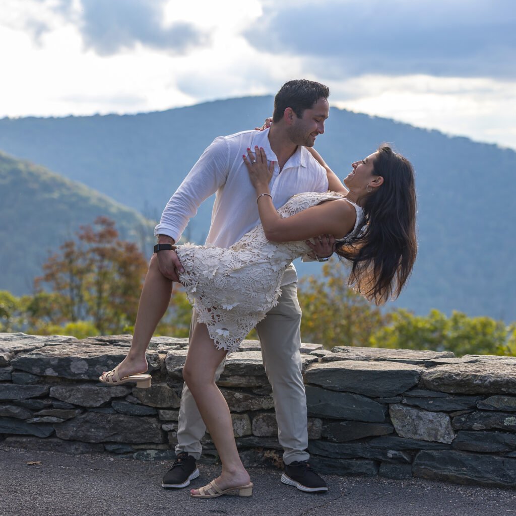 Man dipping his new fiance after proposing to her in Shenandoah National Park